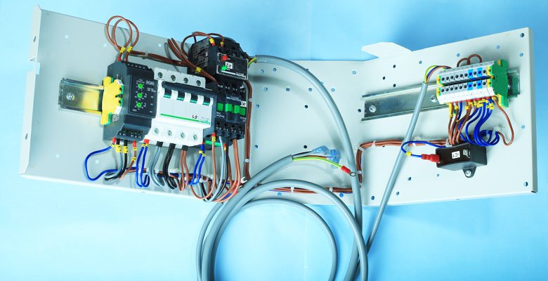 Harness Techniques (I) Pvt. Ltd. ODU panels and wiring harness assembly with neatly routed cables, breakers and terminals for industrial control applications.